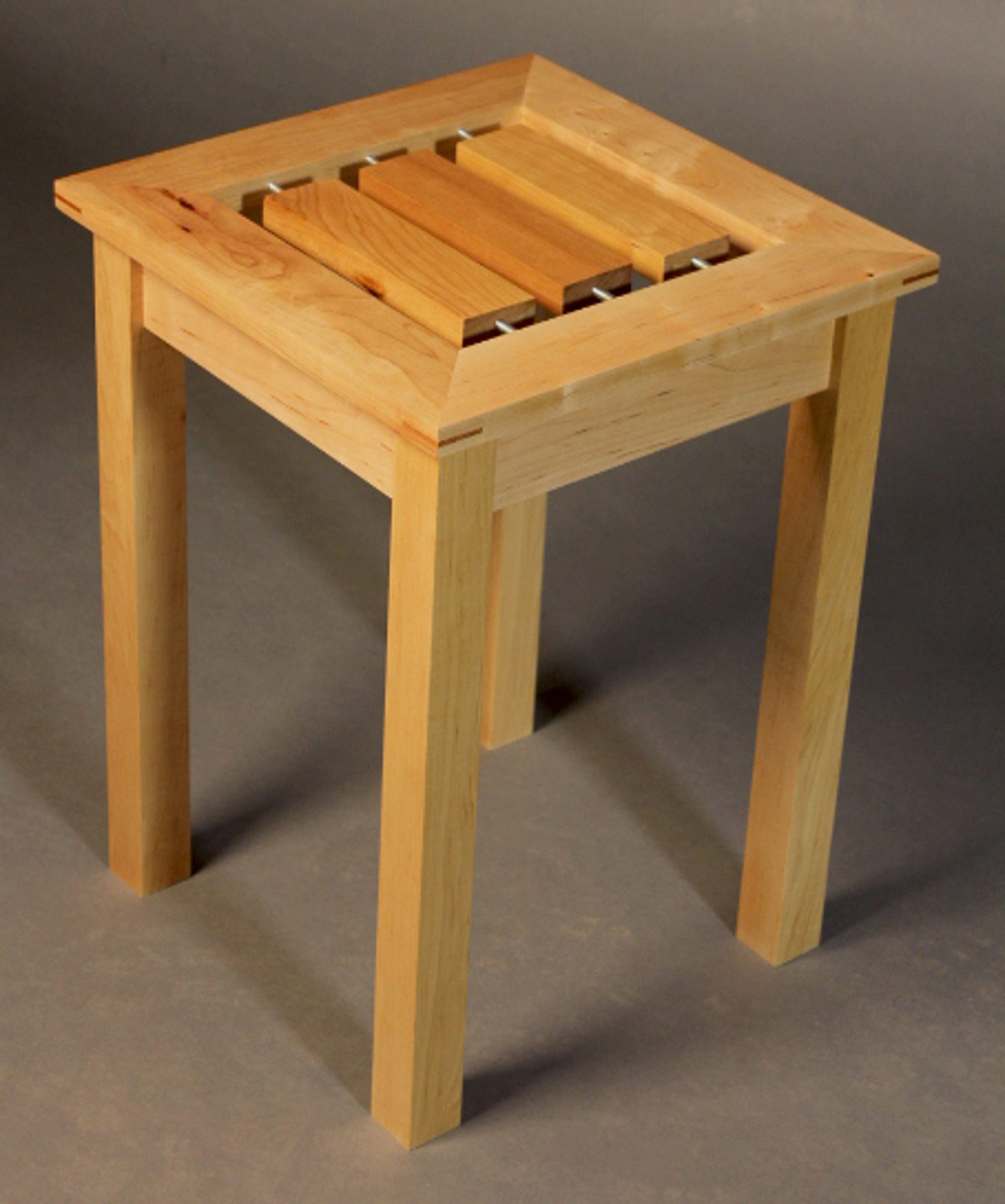 "Spin" - Three tabletop slats spin independently.