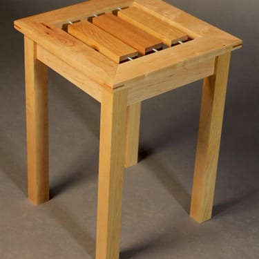 "Spin" - Three tabletop slats spin independently.