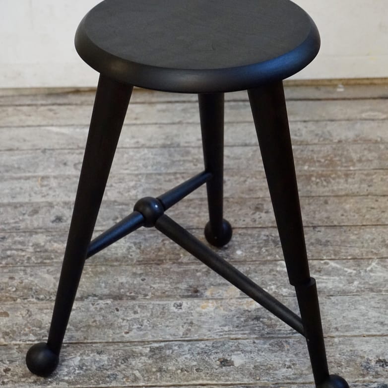 Ebonized ball foot stool