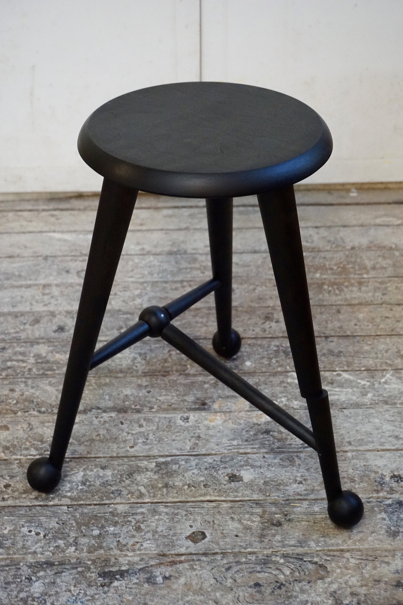 Ebonized ball foot stool