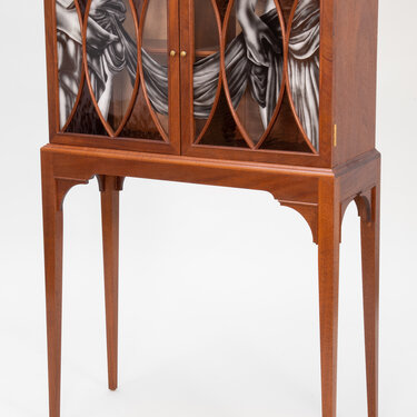 A Partially Draped Cabinet
